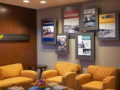 YCC-Reception-2 Custom lobby display wall with mounted graphics and dimensional signage